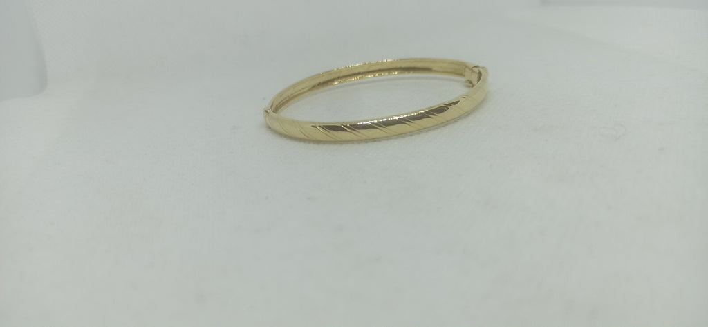 Bracciale Ovale rigido alla schiava oro giallo 18 kt lucido con incisioni donna