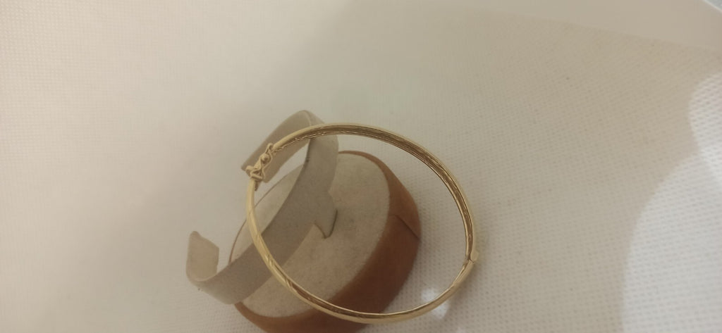 Bracciale Ovale rigido alla schiava oro giallo 18 kt lucido con incisioni donna