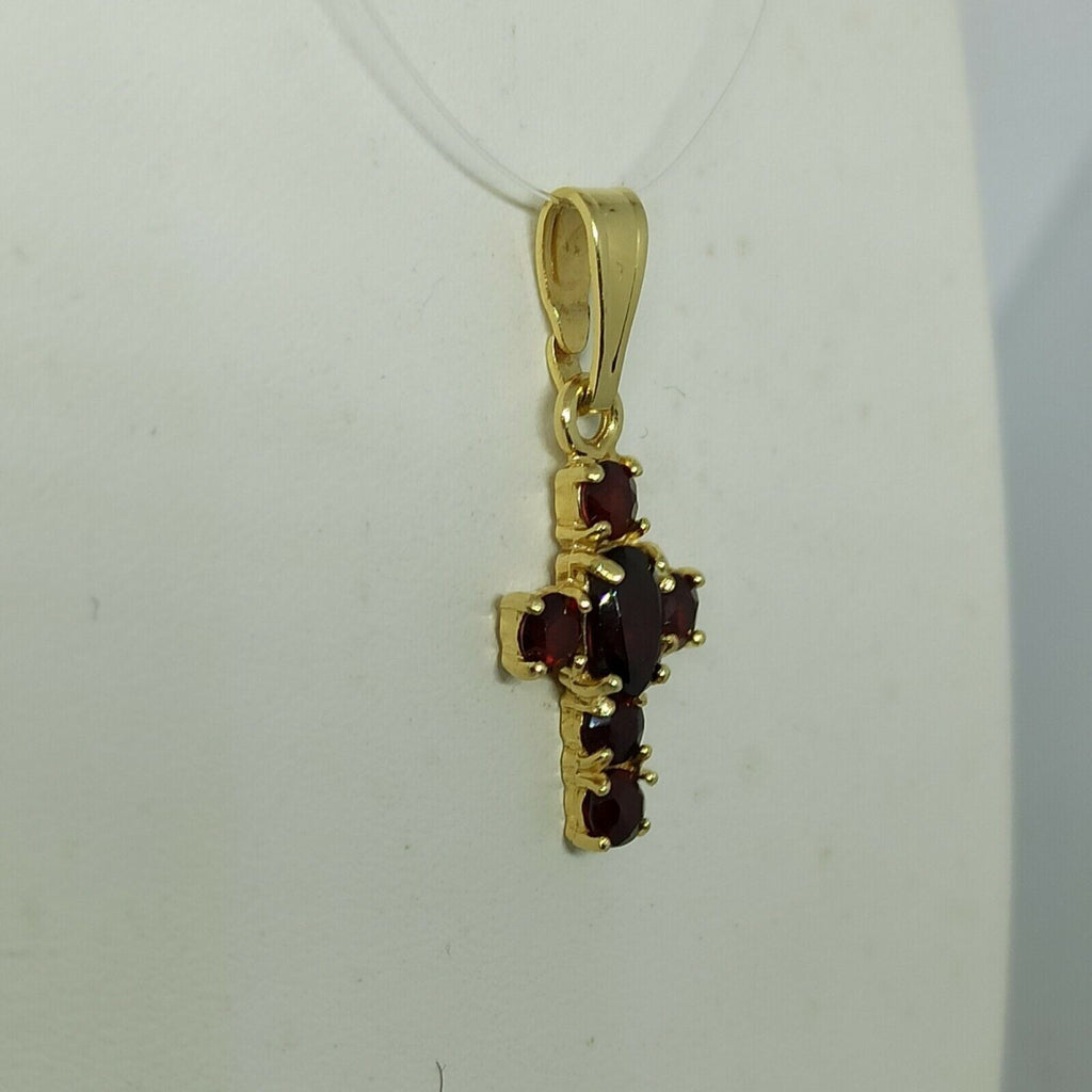Croce in oro giallo  18 kt pendente con granato.
