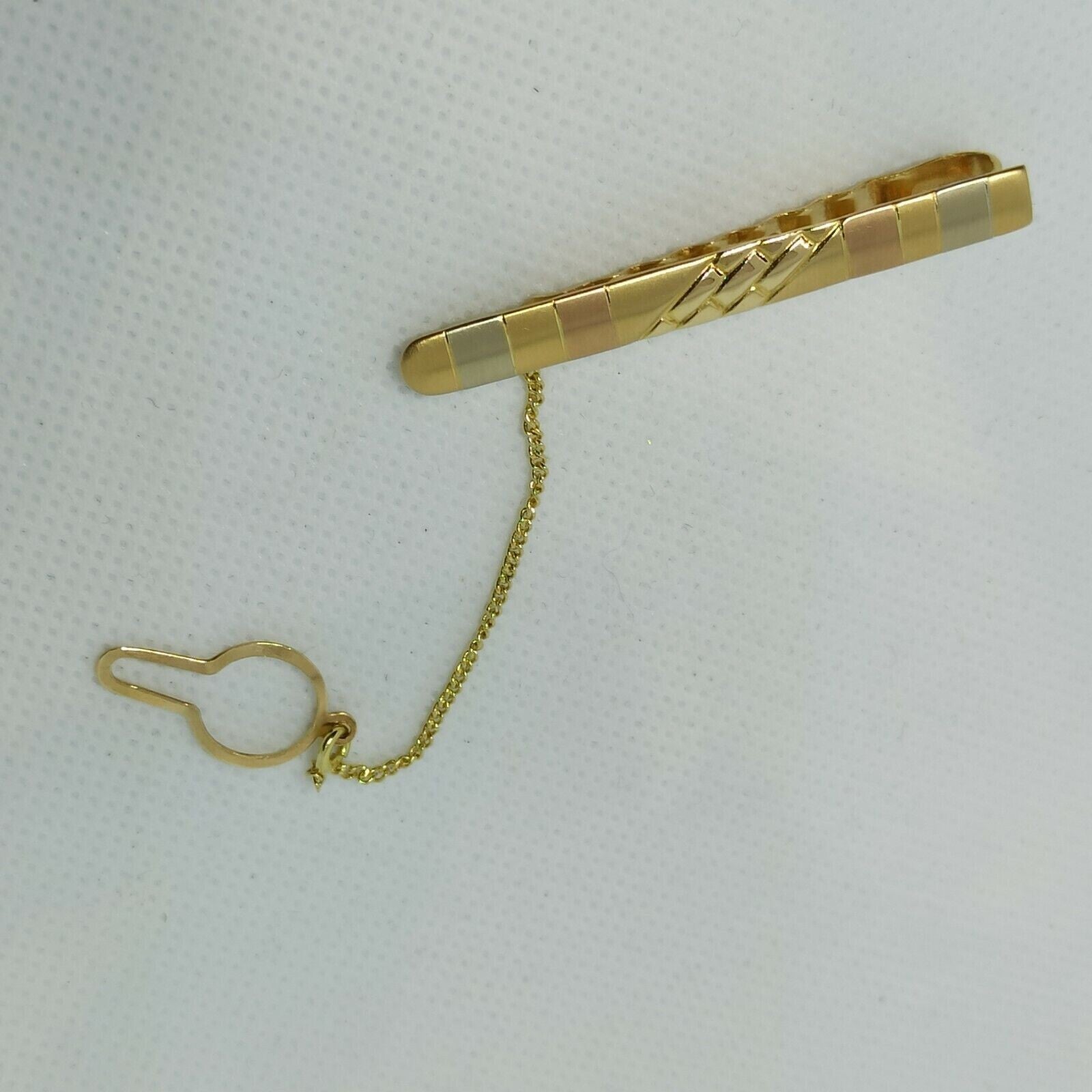 Fermacravatta in oro giallo rosa e  bianco satinato  18 kt