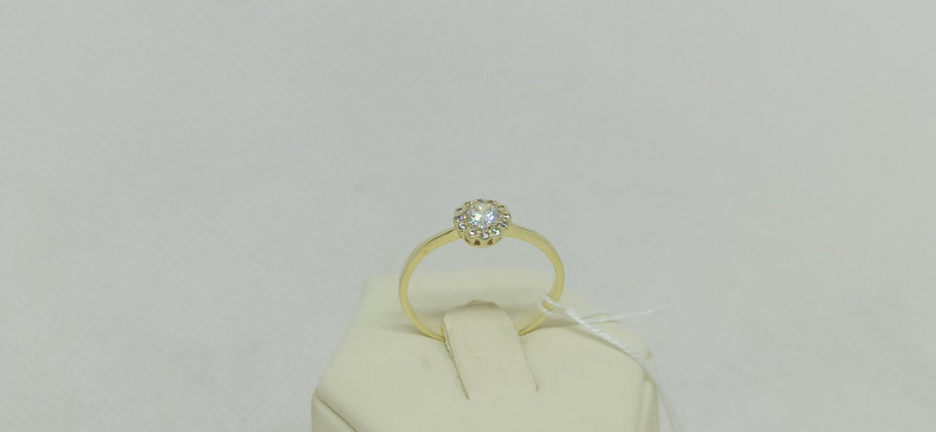 Anello solitario  in oro giallo 9  kt con zirconi.