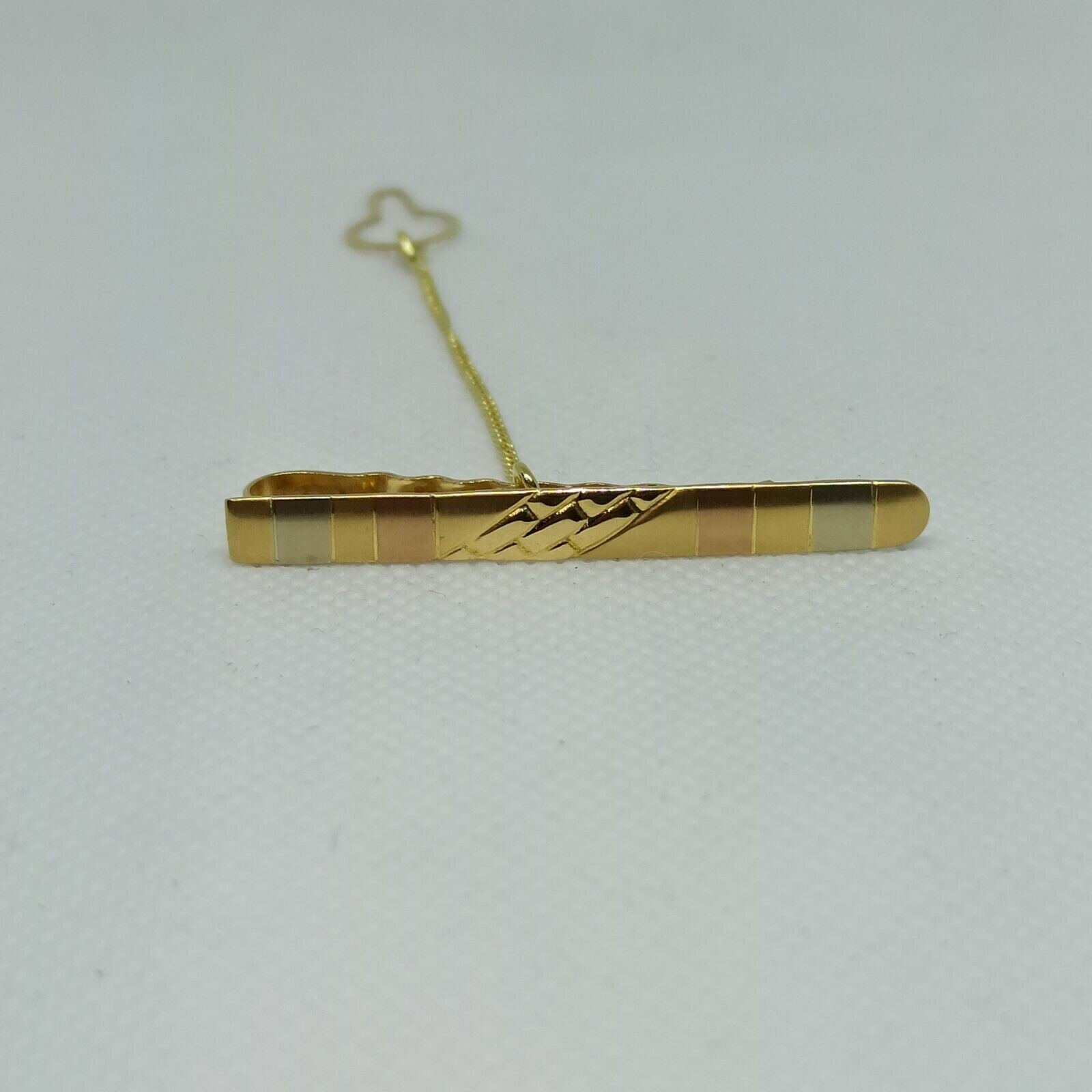 Fermacravatta in oro giallo rosa e  bianco satinato  18 kt