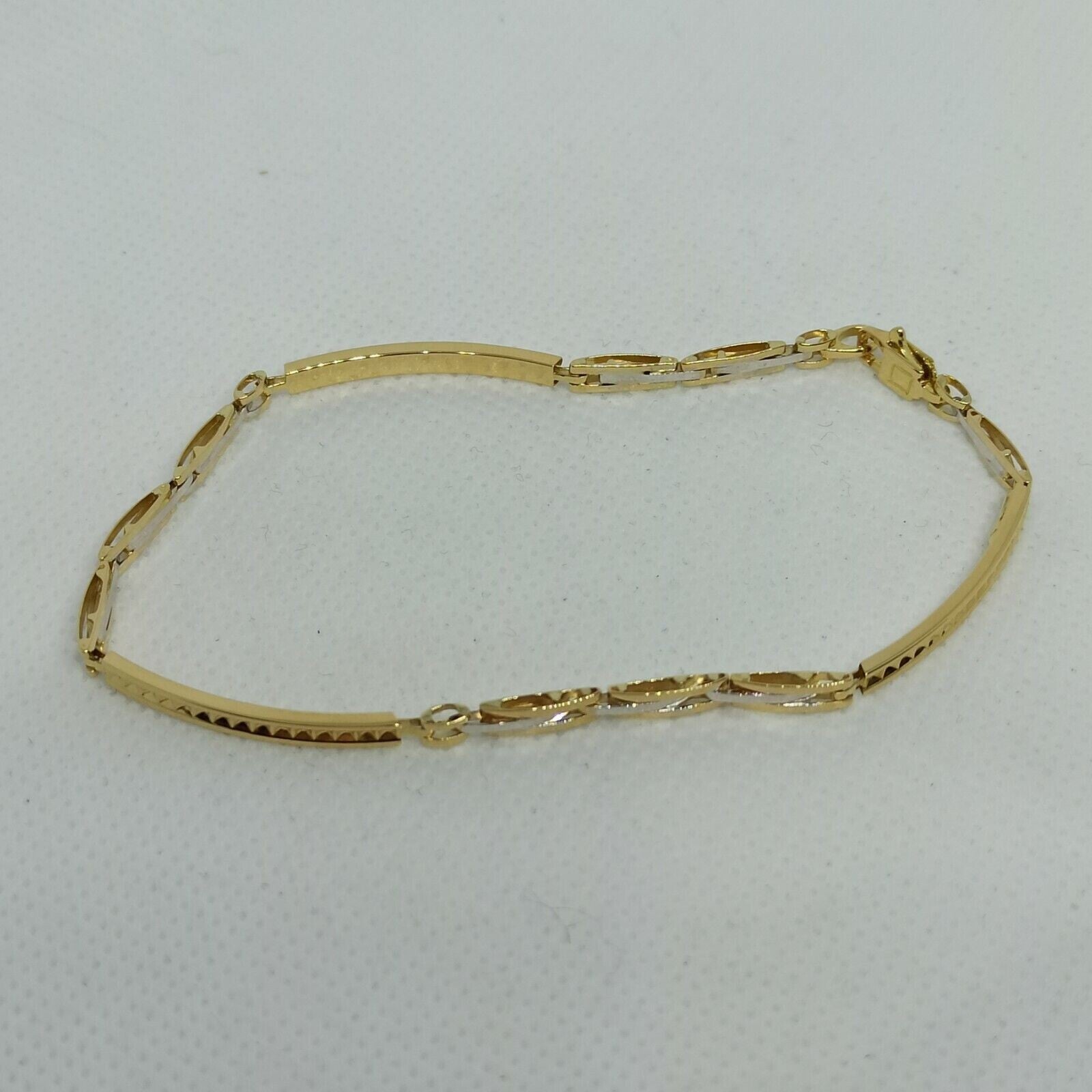 Bracciale a maglie da uomo in oro giallo e bianco 18 kt ( 750)  grammi 5,4. 