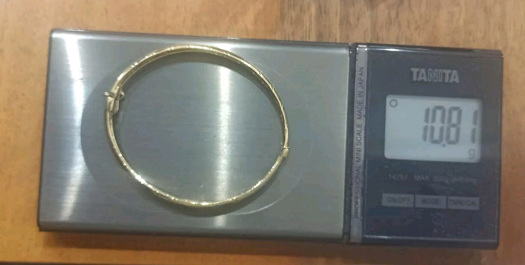 Bracciale Ovale rigido alla schiava oro giallo 18 kt lucido con incisioni donna