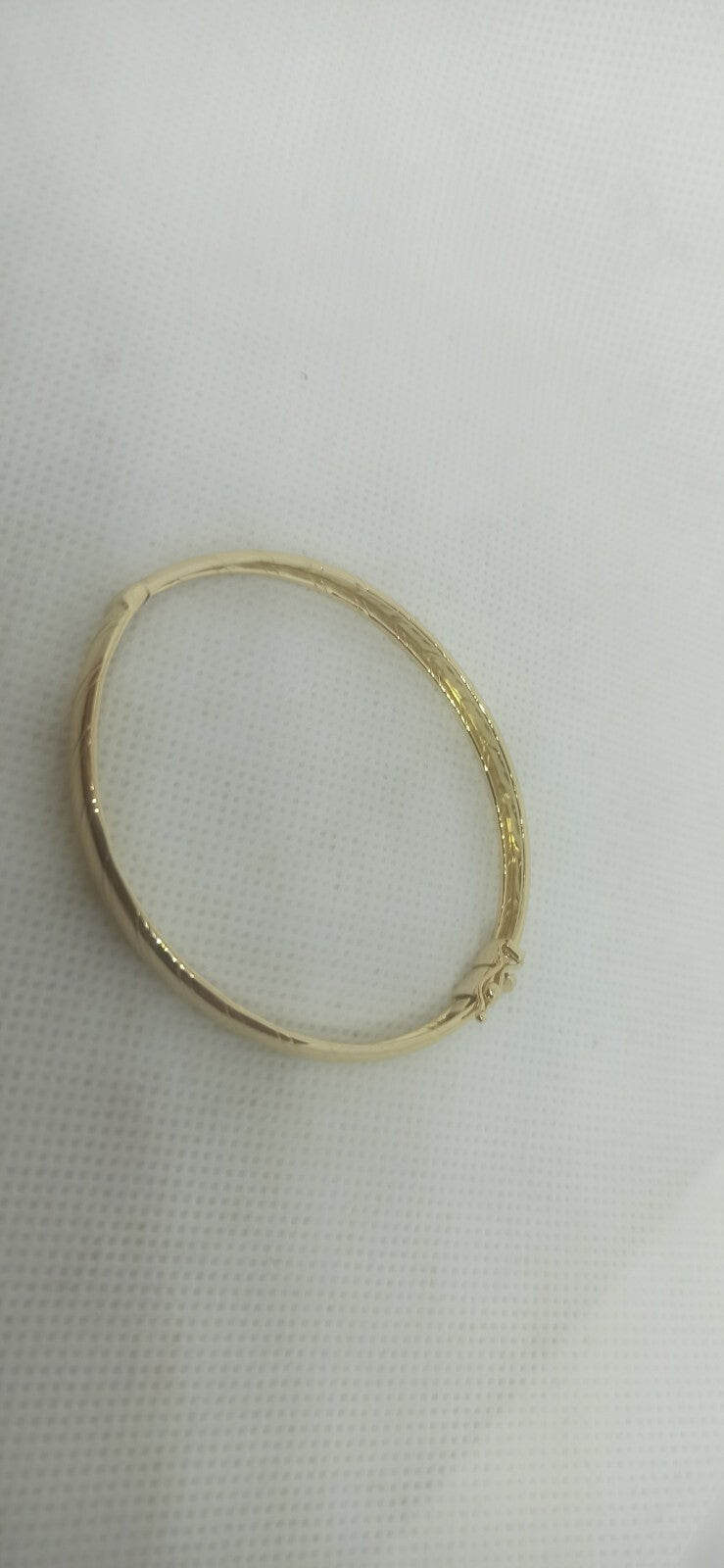 Bracciale Ovale rigido alla schiava oro giallo 18 kt lucido con incisioni donna