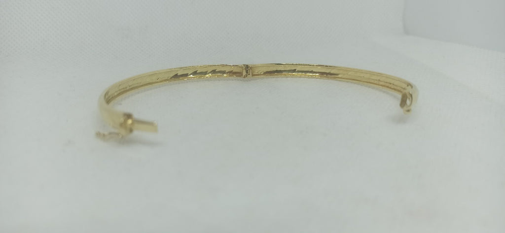 Bracciale Ovale rigido alla schiava oro giallo 18 kt lucido con incisioni donna