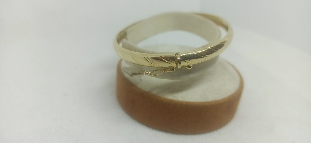 Bracciale Ovale rigido alla schiava oro giallo 18 kt lucido con incisioni donna