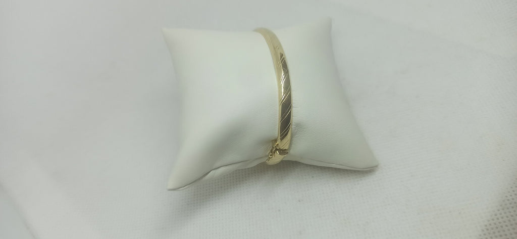 Bracciale Ovale rigido alla schiava oro giallo 18 kt lucido con incisioni donna